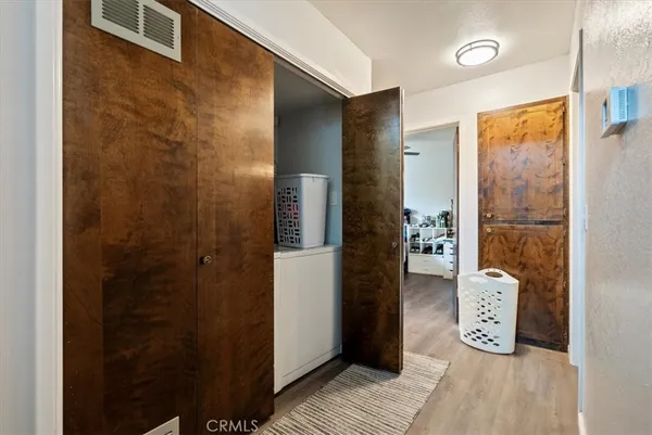 a view of a bedroom with workspace and bedroom