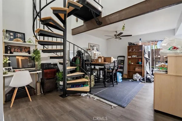 a bedroom with furniture and a flat screen tv