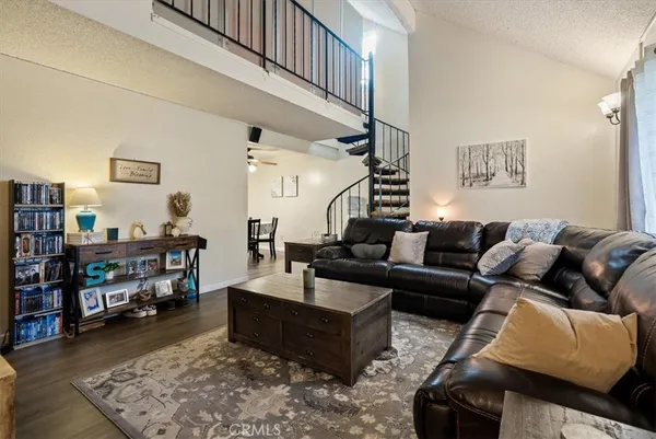 an outdoor view of a house with sitting area and garden