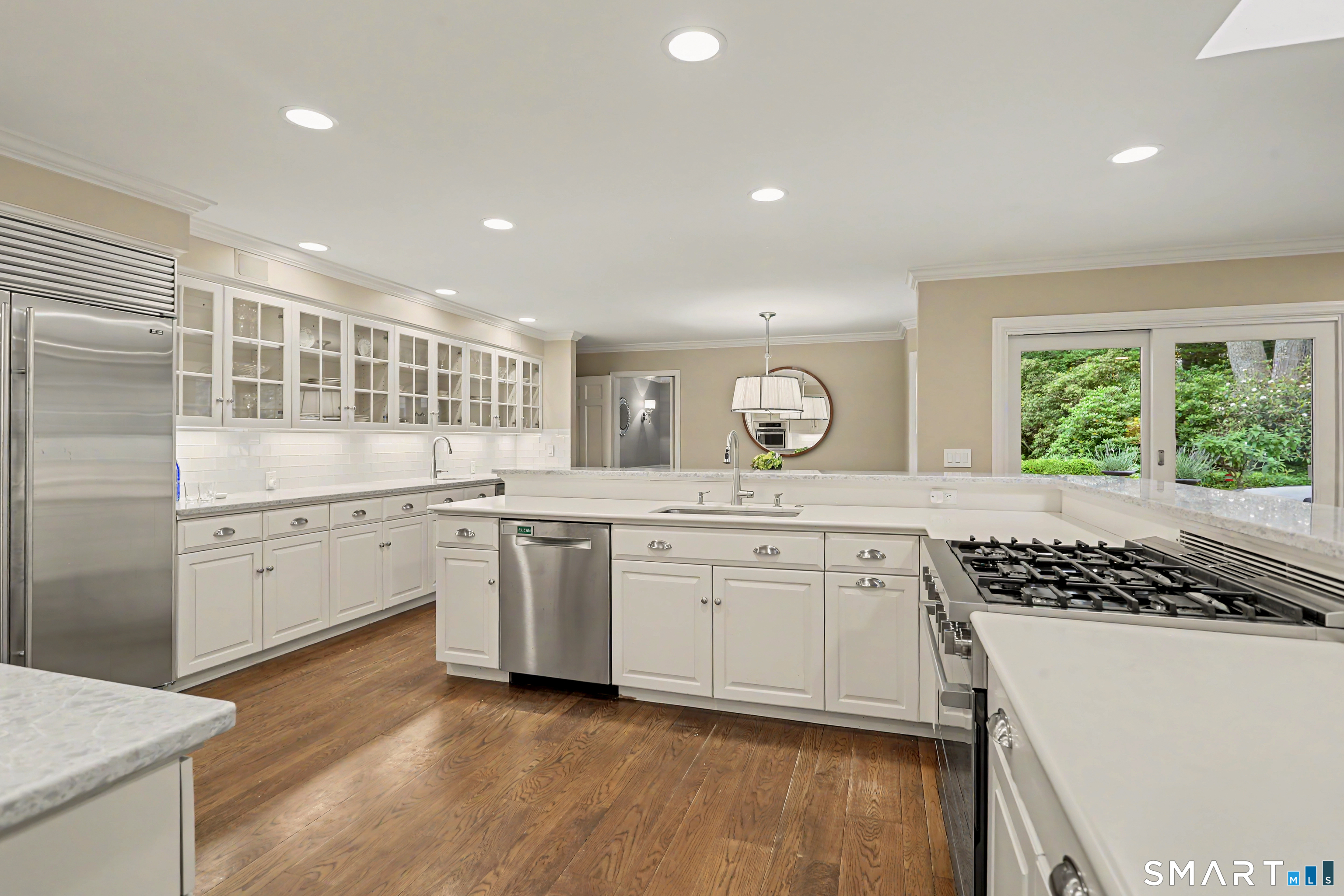 108 Logan Road New Canaan, CT 06840 - Photo 6 of 40 a kitchen with a sink stove and cabinets