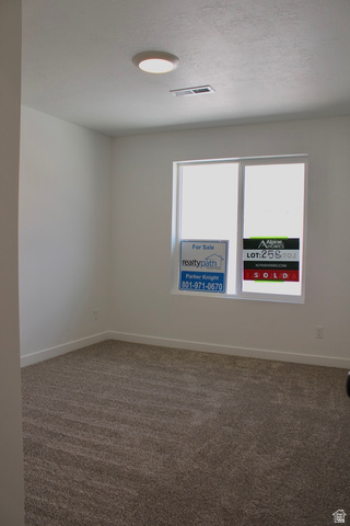 2613 Scarlet Road, Unit 258 Eagle Mountain, UT 84005 - Photo 27 of 32 Bright room with plush, textured carpeting and a single window featuring a white frame
