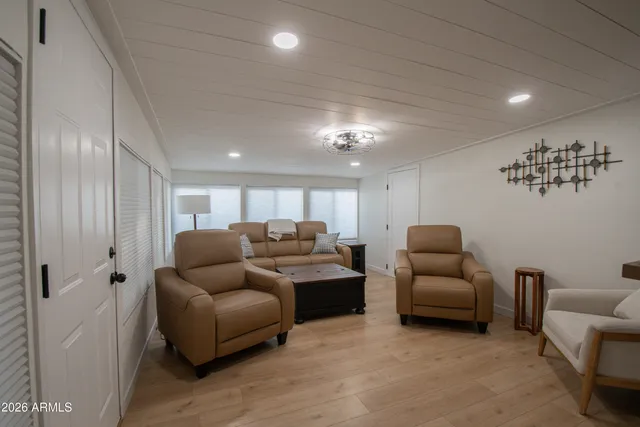 a spacious bedroom with a bed and a window