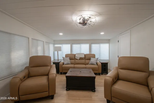 a bathroom with a granite countertop sink a shower and a mirror