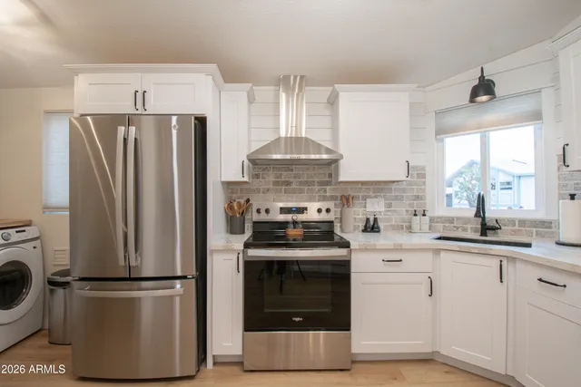 a living room with furniture and a ceiling fan