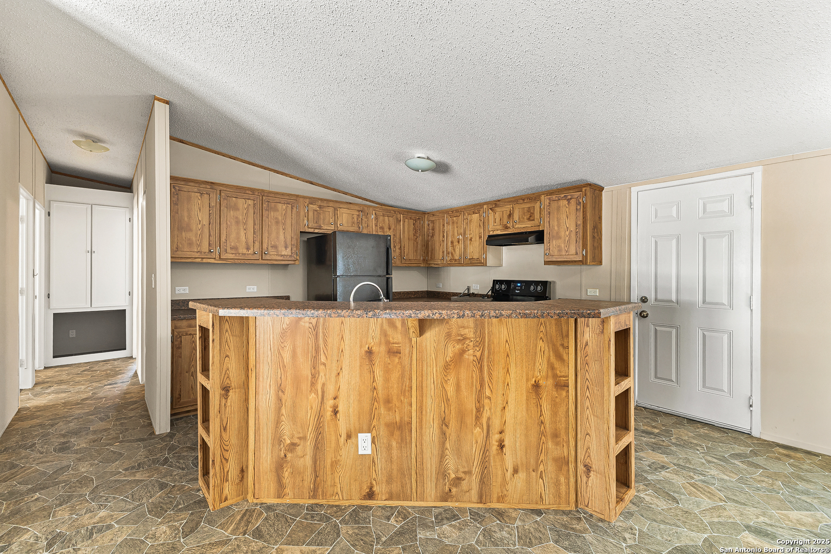 823 County Road 6850 Lytle, TX 78052 - Photo 11 of 33 a view of kitchen with stainless steel appliances granite countertop a refrigerator and a stove top oven