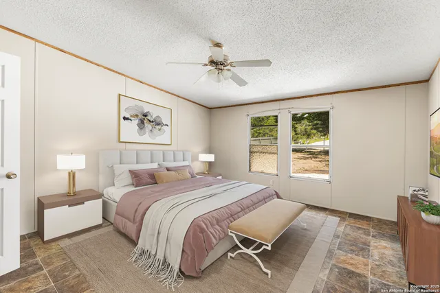 a bedroom with a bed and a window