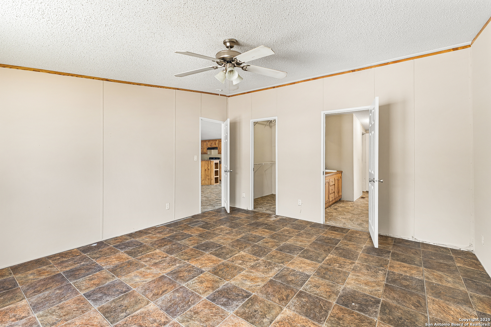 823 County Road 6850 Lytle, TX 78052 - Photo 16 of 33 a view of a big room with a chandelier fan and closet