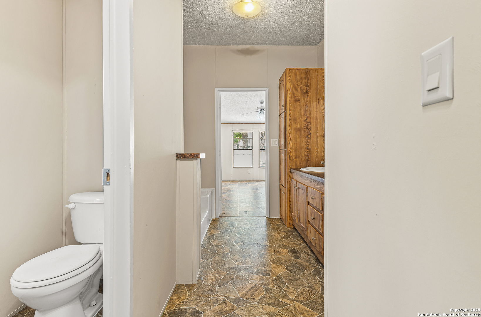 823 County Road 6850 Lytle, TX 78052 - Photo 18 of 33 a bathroom with a toilet and a shower