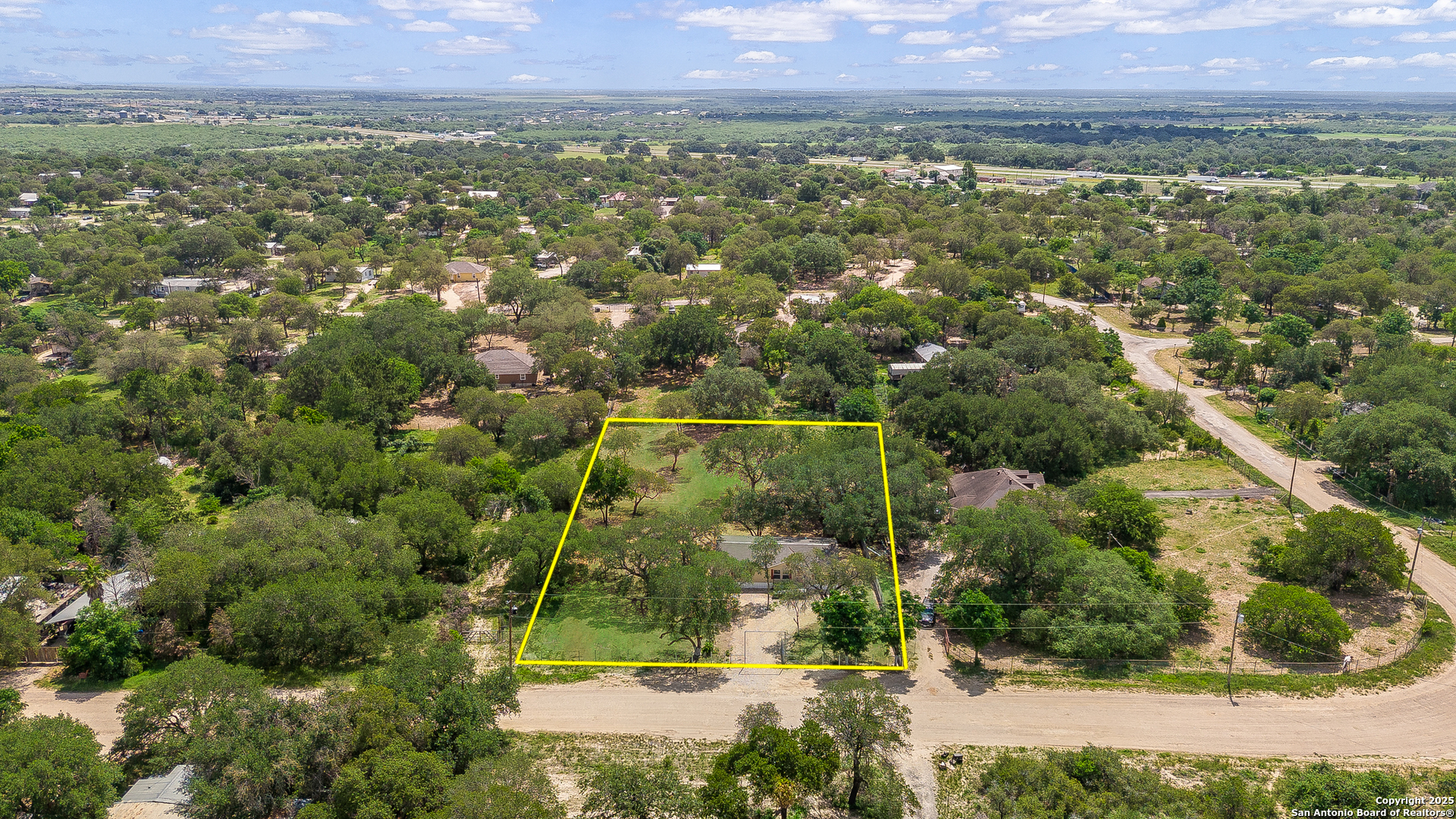 823 County Road 6850 Lytle, TX 78052 - Photo 28 of 33 a view of a city with lush green forest