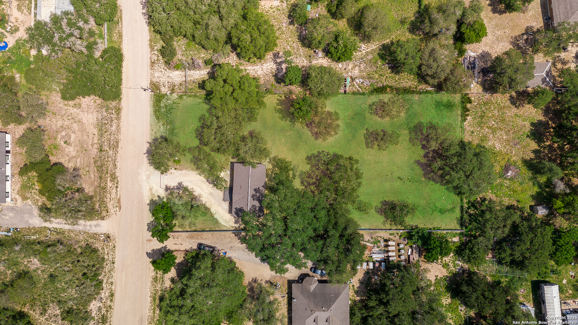 823 County Road 6850 Lytle, TX 78052 - Photo 33 of 33 an aerial view of residential houses with outdoor space