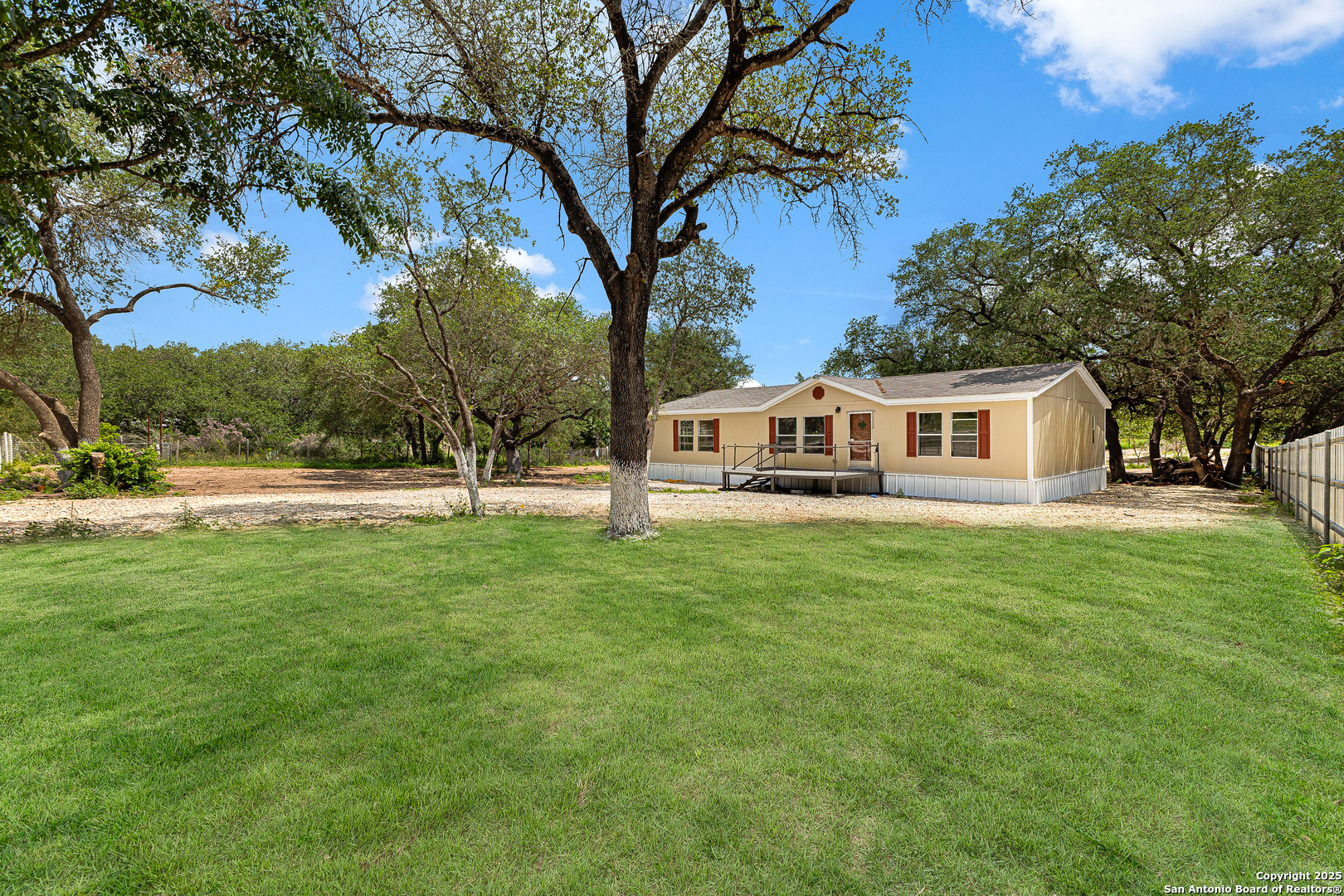 823 County Road 6850 Lytle, TX 78052 - Photo 4 of 33 a view of house with yard and entertaining space