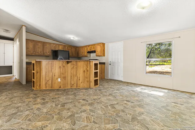 a view of a kitchen with a sink
