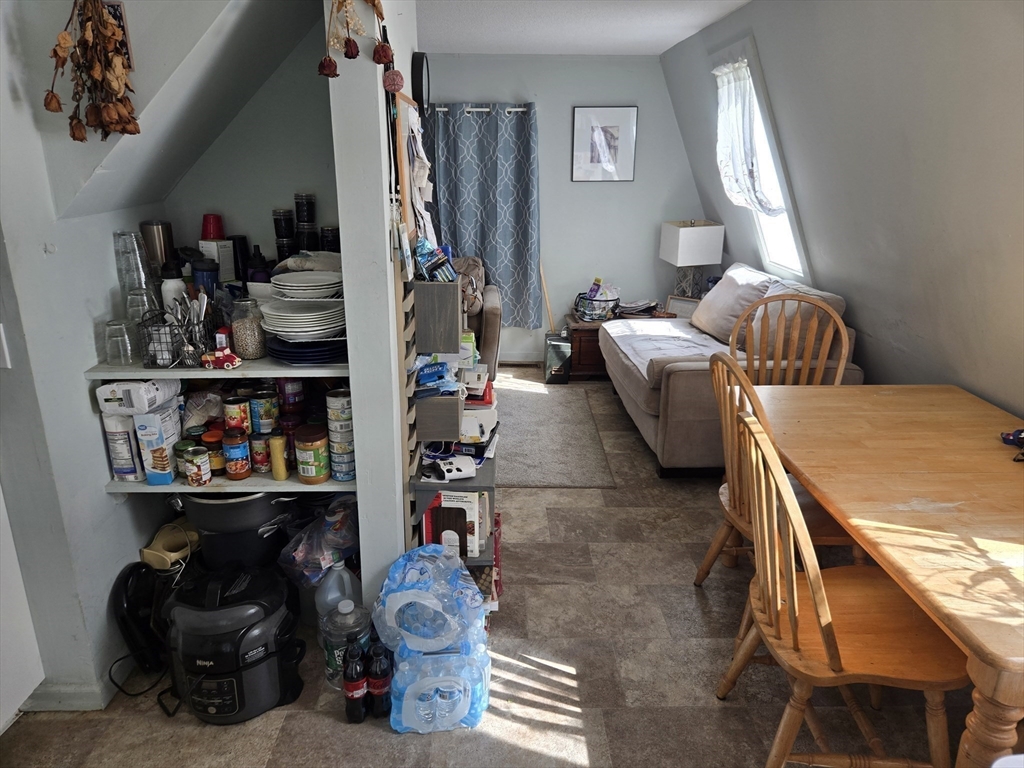 121 Amherst Road Pelham, MA 01002 - Photo 16 of 31 a living room with lots of furniture and clothes