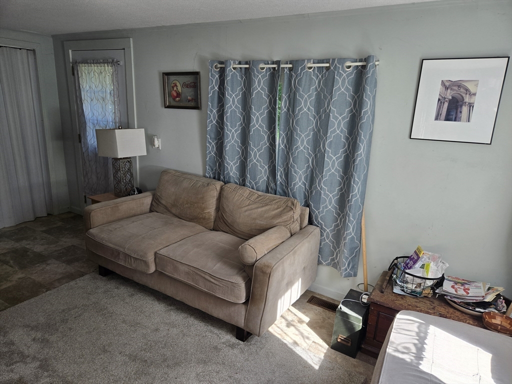 121 Amherst Road Pelham, MA 01002 - Photo 17 of 31 a living room with furniture and a bed