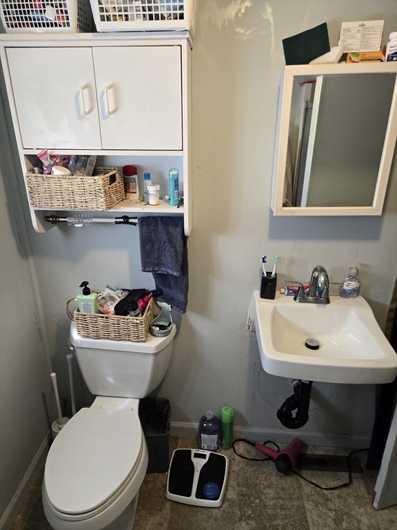 121 Amherst Road Pelham, MA 01002 - Photo 19 of 31 a bathroom with a sink a toilet and mirror