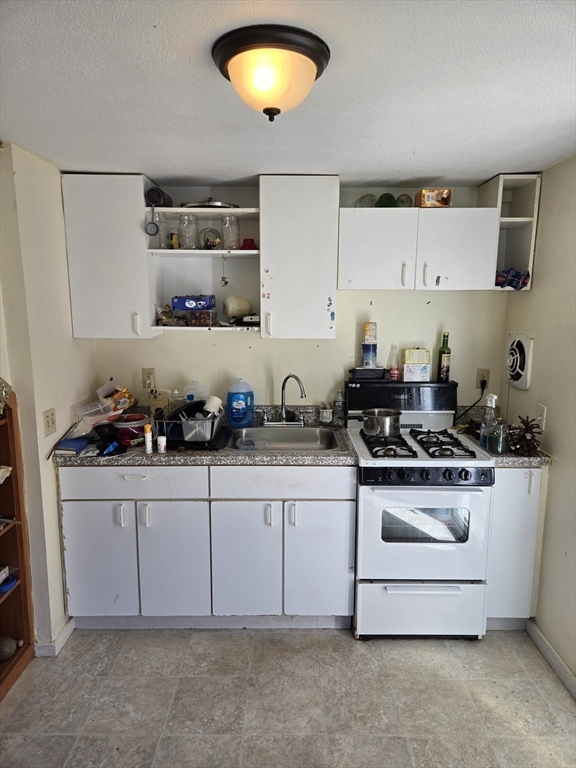 121 Amherst Road Pelham, MA 01002 - Photo 23 of 31 a kitchen with stainless steel appliances a stove a sink and a refrigerator
