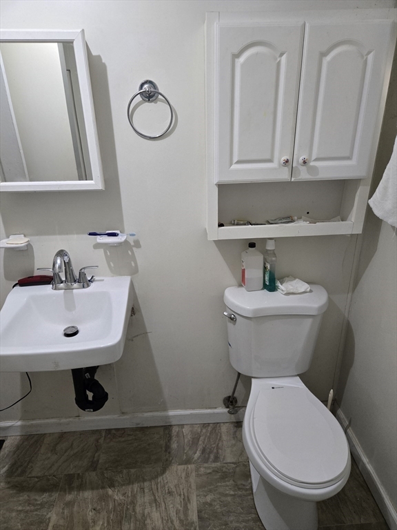 121 Amherst Road Pelham, MA 01002 - Photo 25 of 31 a bathroom with a toilet a sink and mirror