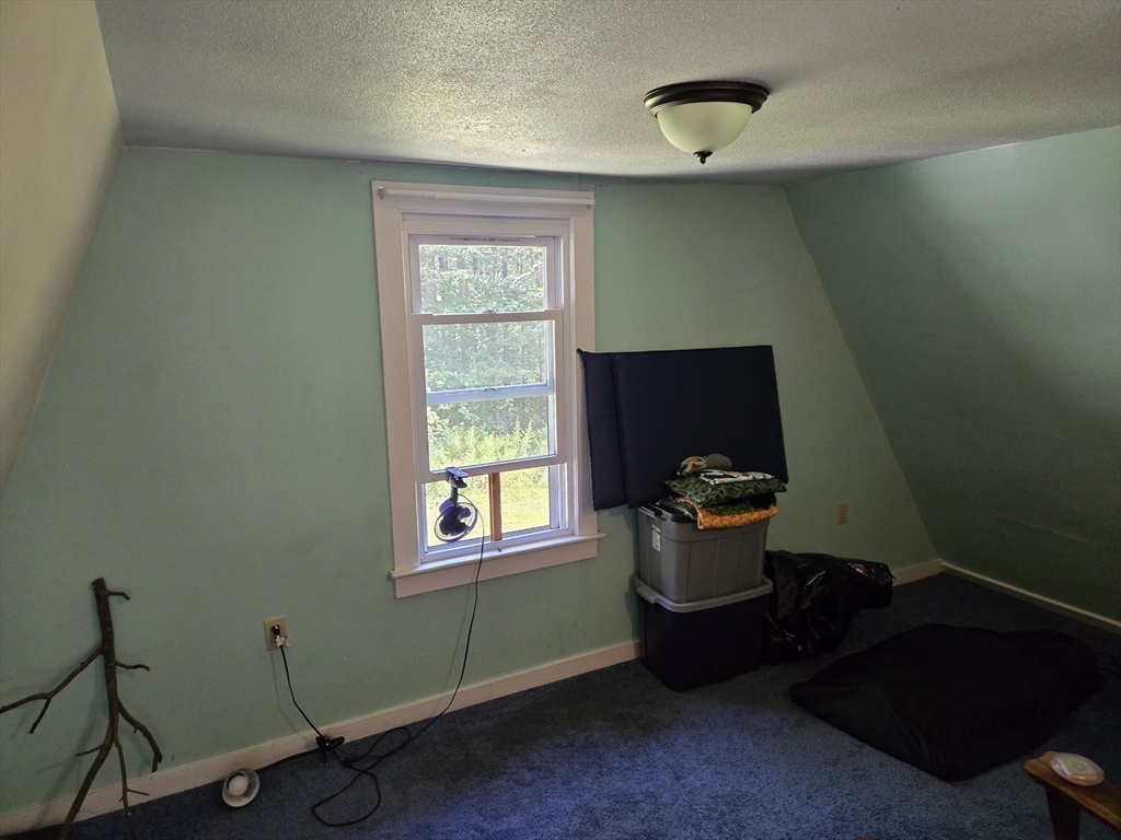 121 Amherst Road Pelham, MA 01002 - Photo 28 of 31 a room with furniture and window
