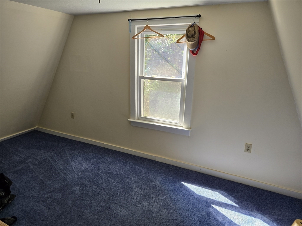 121 Amherst Road Pelham, MA 01002 - Photo 29 of 31 an empty room with a window