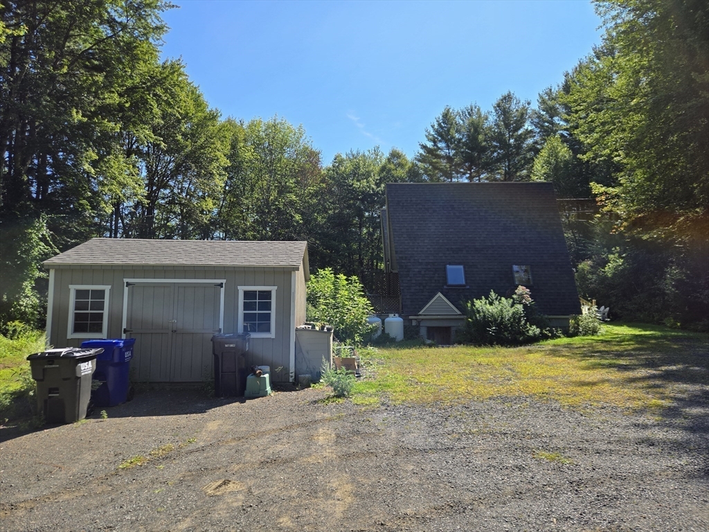 121 Amherst Road Pelham, MA 01002 - Photo 31 of 31 front view of a house with a yard