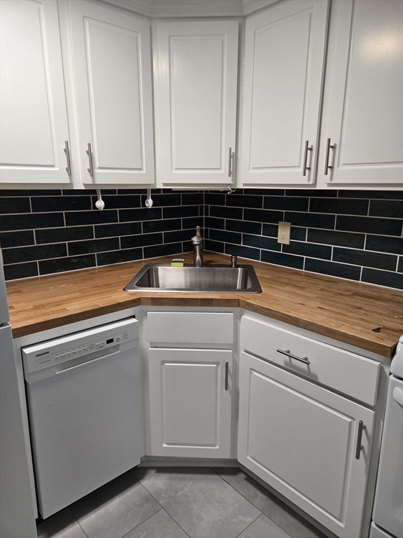 121 Amherst Road Pelham, MA 01002 - Photo 4 of 31 a view of a kitchen with granite countertop white cabinets and sink