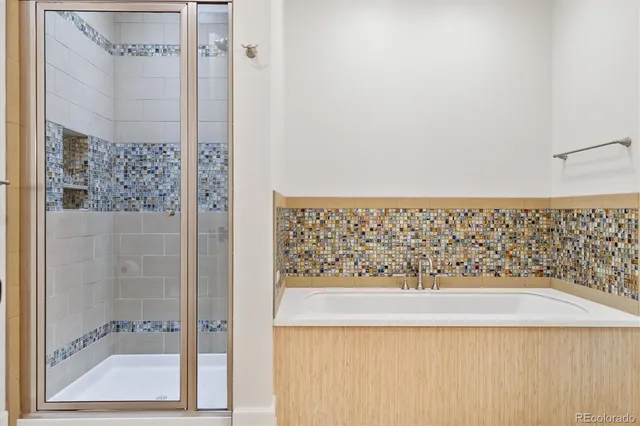 a view of a tables and chairs under an umbrella in patio