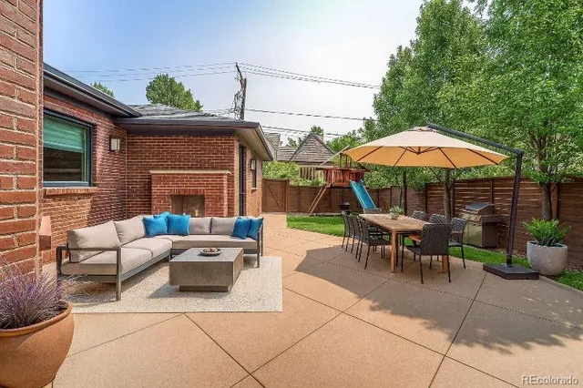 a view of a backyard with chairs