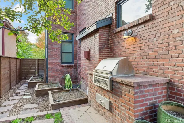 an aerial view of multiple houses with yard