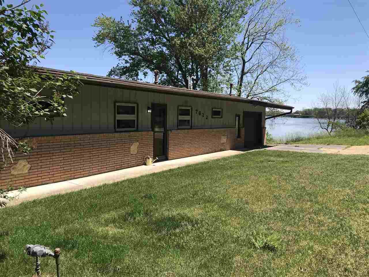 7632 North River Road Byron, IL 61010 - Photo 2 of 15 a house view with garden space