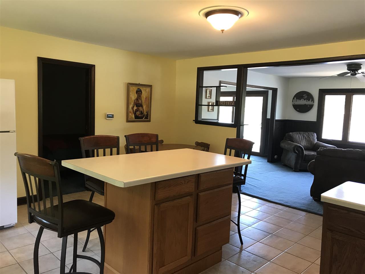 7632 North River Road Byron, IL 61010 - Photo 4 of 15 a view of a dining room with furniture and wooden floor