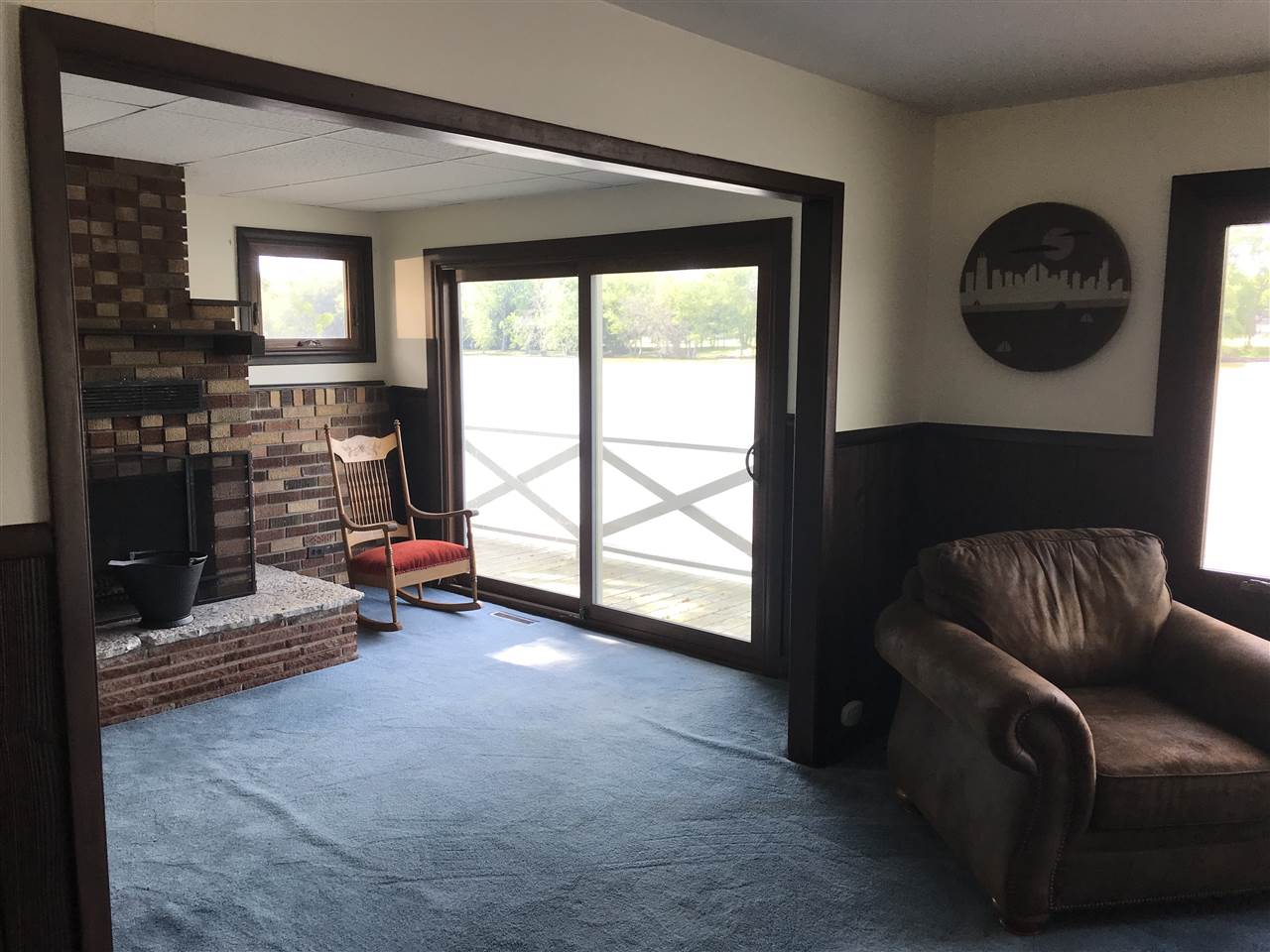 7632 North River Road Byron, IL 61010 - Photo 9 of 15 a living room with furniture and a window