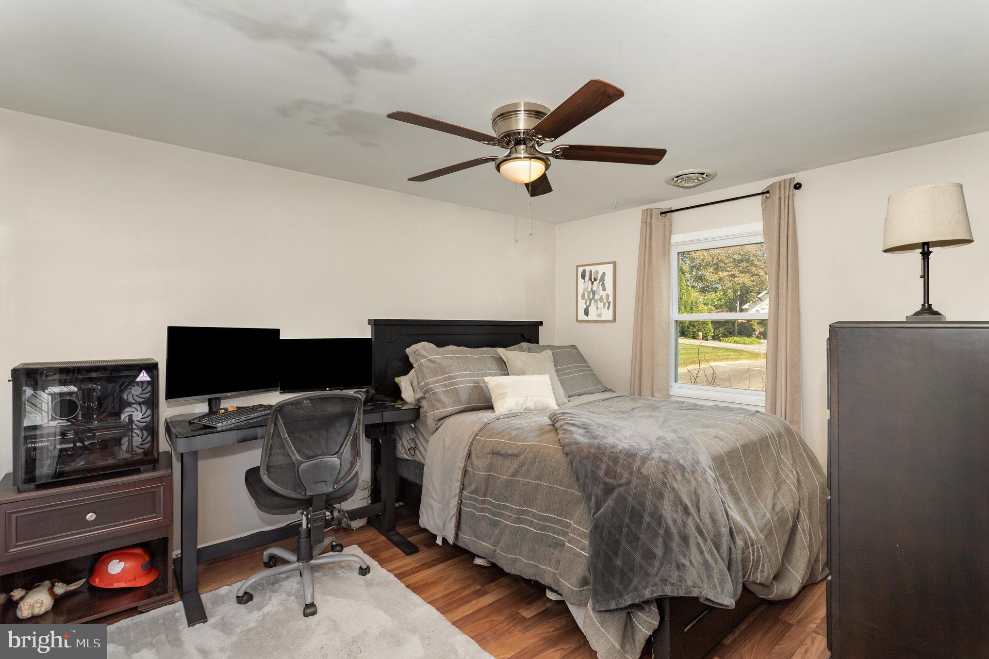 136 Greenwich Road Delta, PA 17314 - Photo 25 of 56 a bedroom with a bed and a chandelier