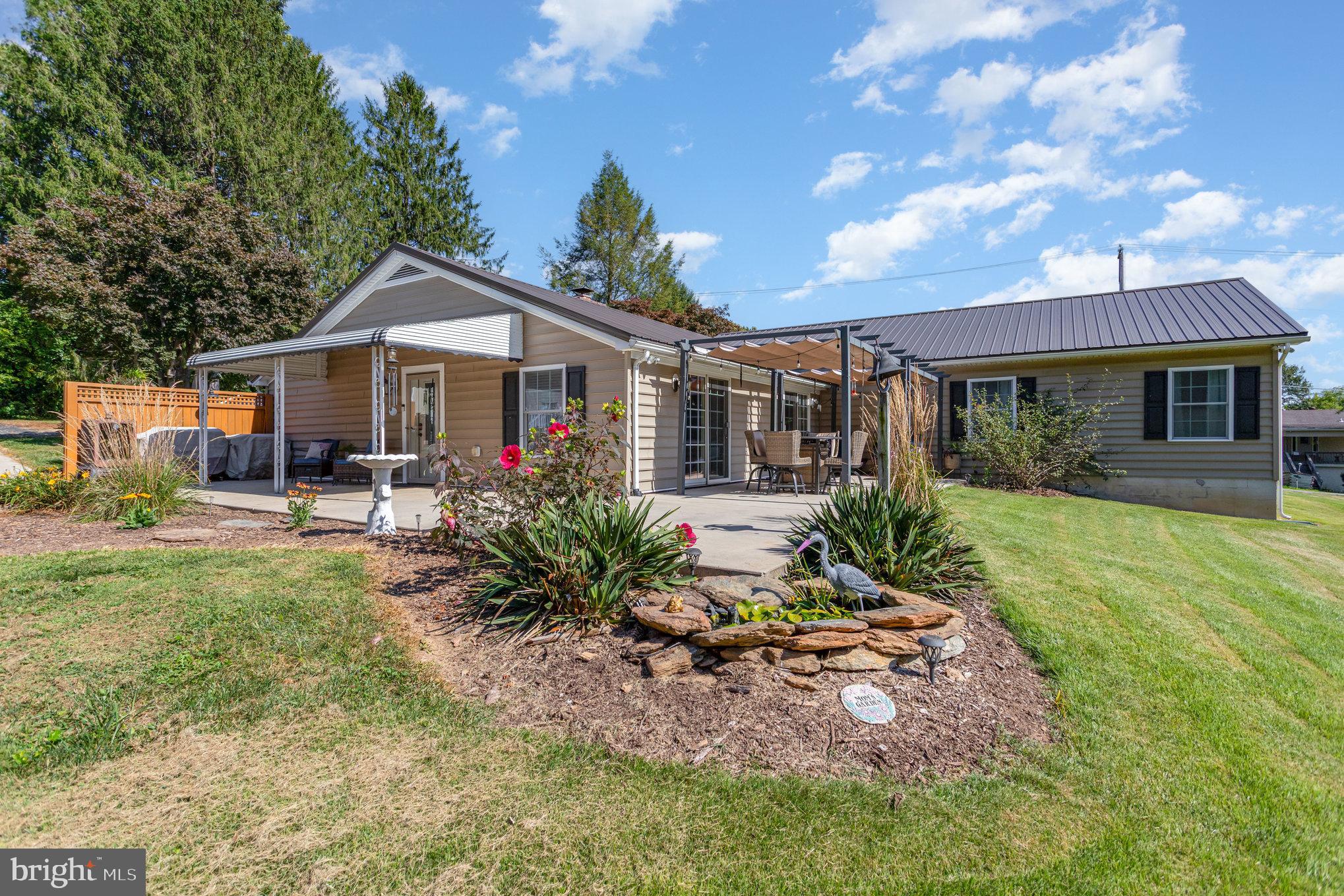 136 Greenwich Road Delta, PA 17314 - Photo 34 of 56 a front view of a house with a yard table and chairs