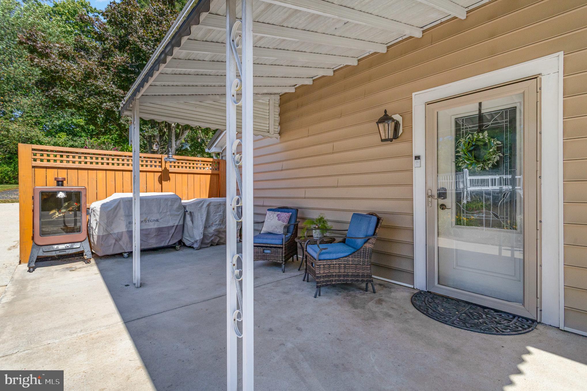136 Greenwich Road Delta, PA 17314 - Photo 36 of 56 a view of a lounge chairs in the back yard of the house