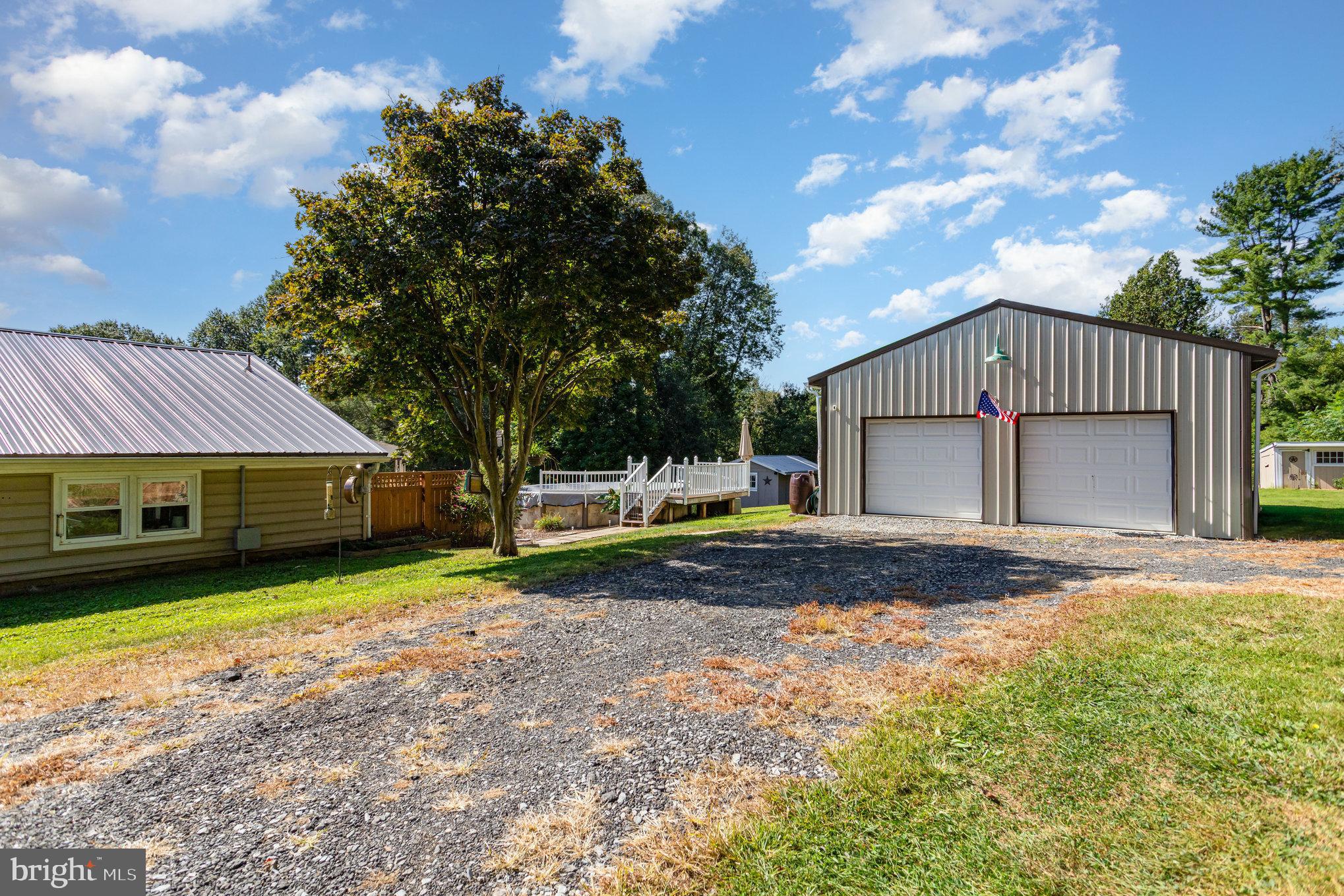 136 Greenwich Road Delta, PA 17314 - Photo 39 of 56 a front view of a house with a yard and garage