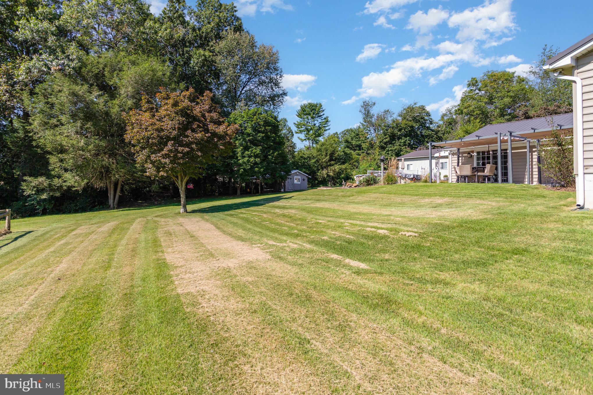136 Greenwich Road Delta, PA 17314 - Photo 42 of 56 a view of a big yard with large trees