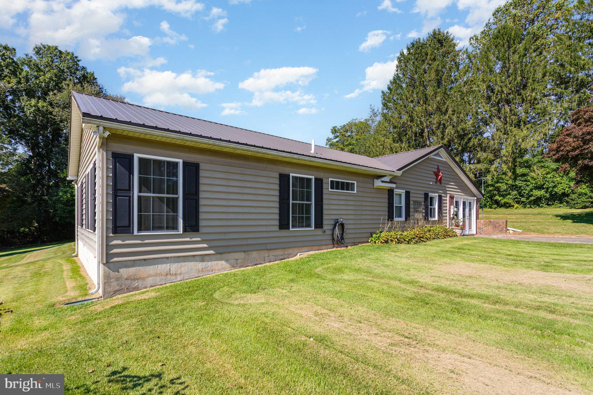 136 Greenwich Road Delta, PA 17314 - Photo 5 of 56 a front view of a house with a garden