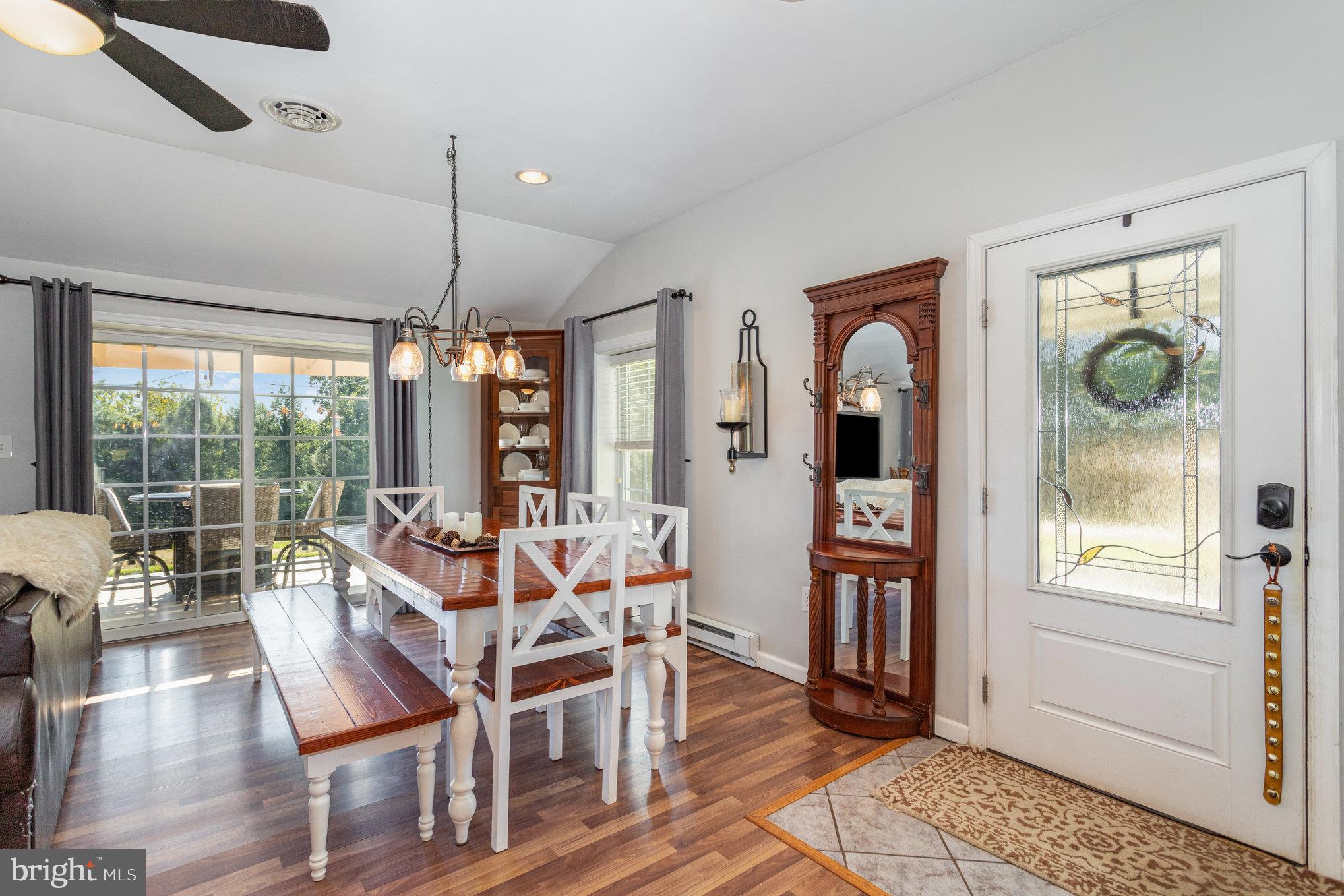 136 Greenwich Road Delta, PA 17314 - Photo 7 of 56 a view of a dining room with furniture wooden floor and chandelier