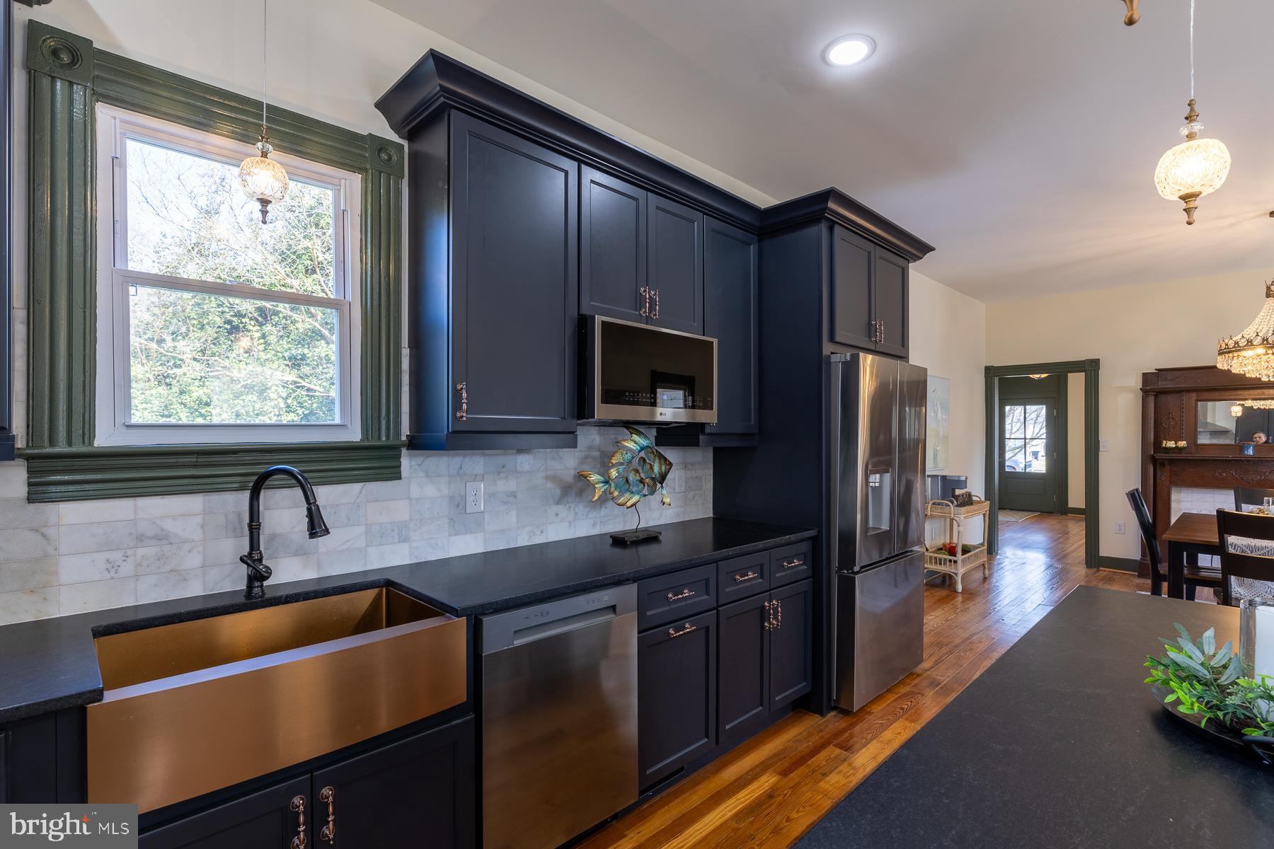 296 Beach Road White Stone, VA 22578 - Photo 19 of 51 a kitchen with stainless steel appliances a sink stove and refrigerator