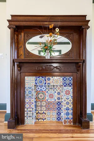a work room with furniture wooden floor and windows