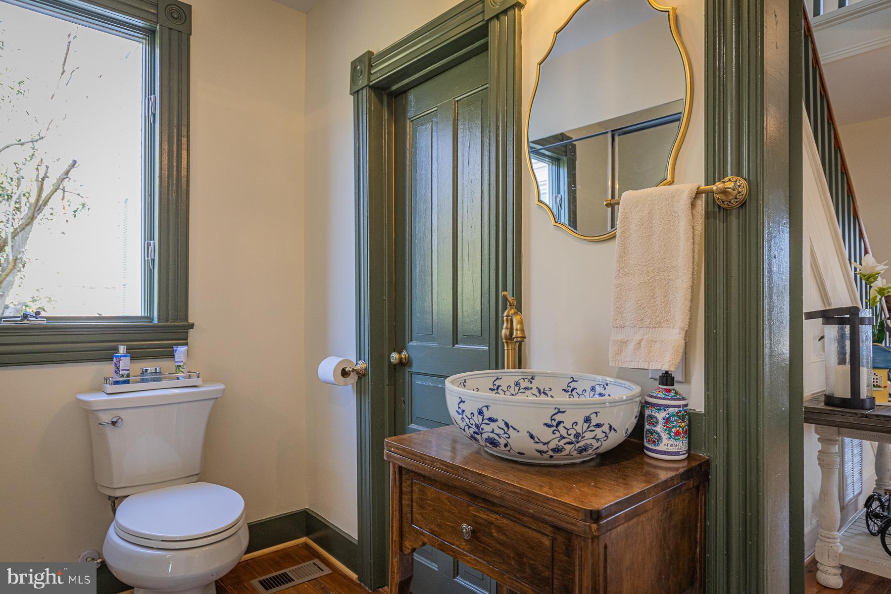 296 Beach Road White Stone, VA 22578 - Photo 24 of 51 a bathroom with a granite countertop toilet sink and mirror