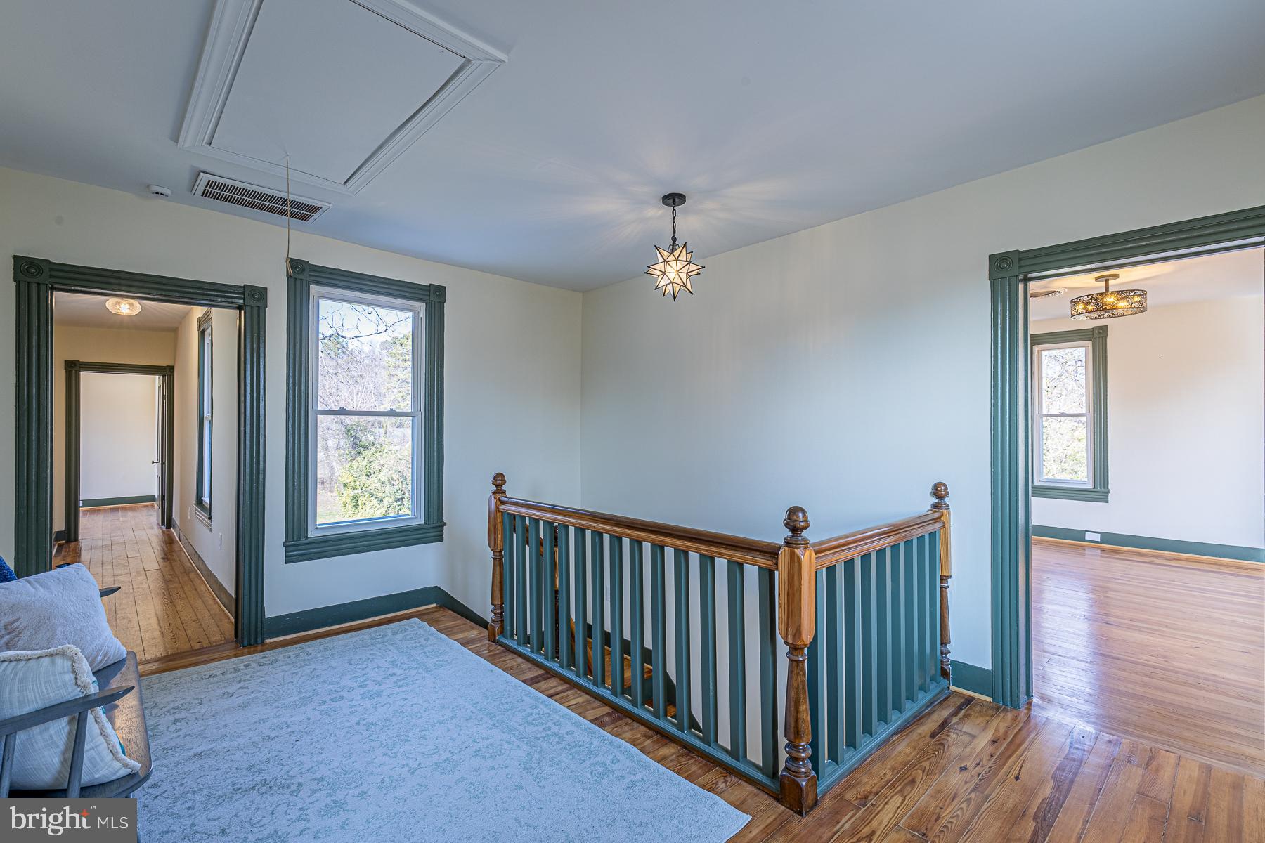 296 Beach Road White Stone, VA 22578 - Photo 26 of 51 a view of a hallway with windows and stairs