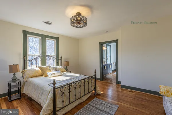 a bedroom with bed and a window