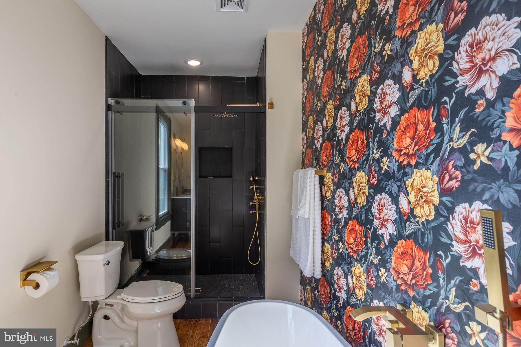 296 Beach Road White Stone, VA 22578 - Photo 31 of 51 a bathroom with a toilet and a shower curtain