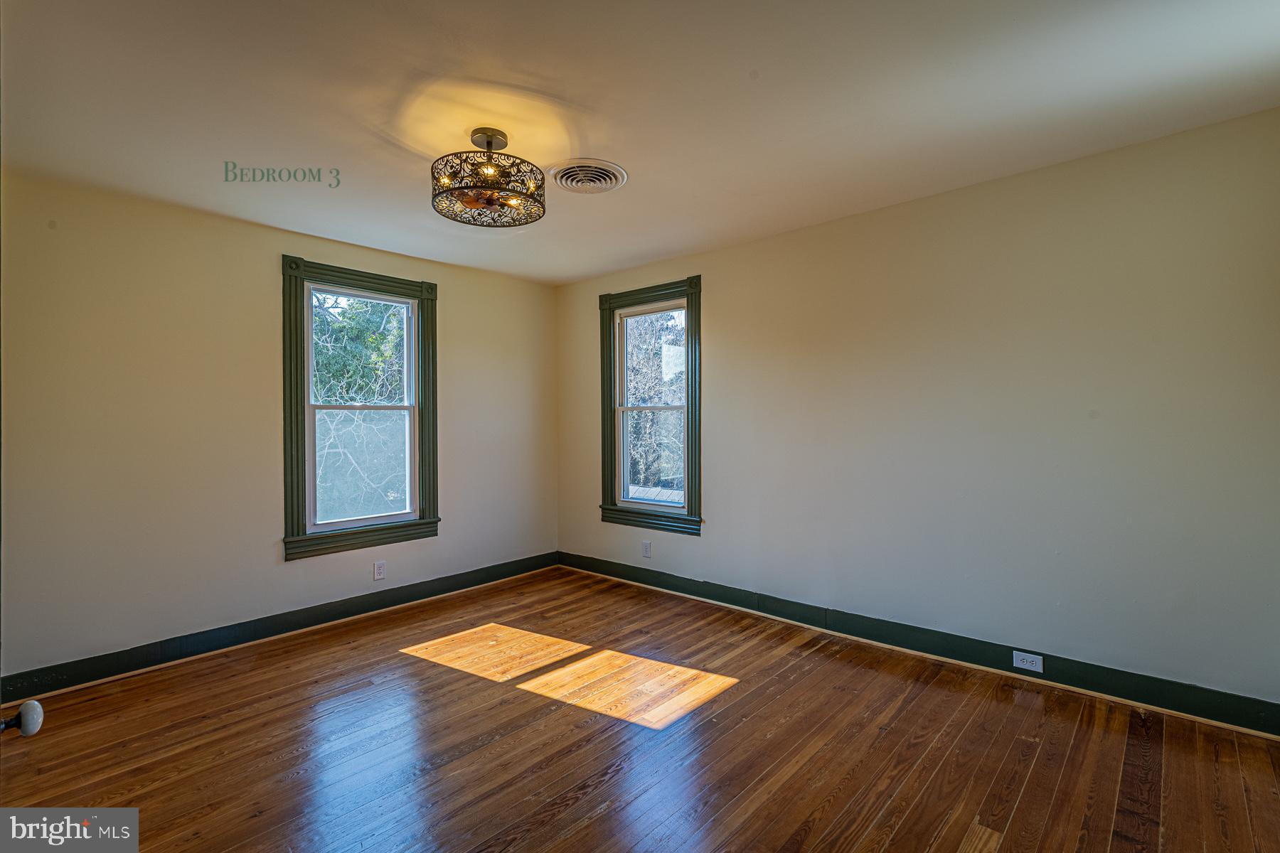 296 Beach Road White Stone, VA 22578 - Photo 34 of 51 a view of empty room with window and wooden floor