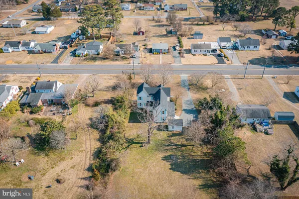 an aerial view of a house with a garden
