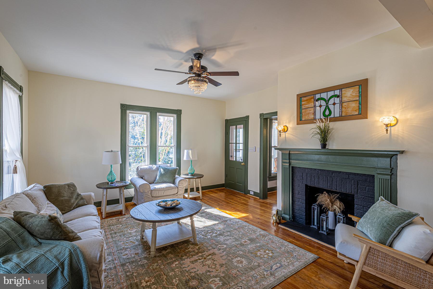 296 Beach Road White Stone, VA 22578 - Photo 10 of 51 a living room with furniture a fireplace and window