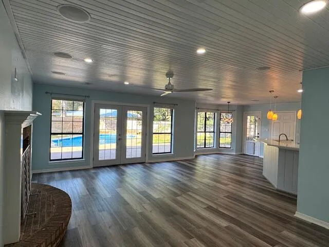 a view of a kitchen with a sink and cabinets