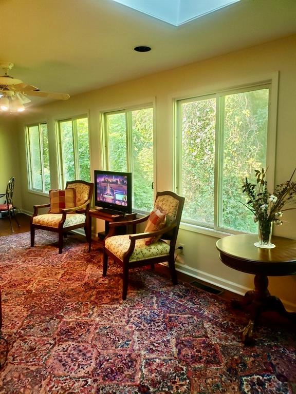 6500 Gaines Ferry Road, Unit I4 Flowery Branch, GA 30542 - Photo 11 of 30 a living room with furniture and a window