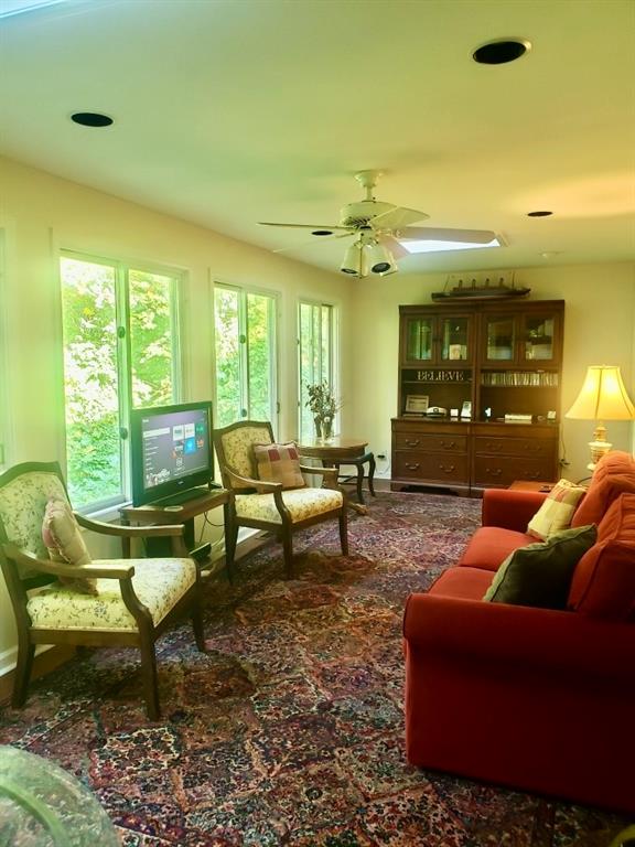 6500 Gaines Ferry Road, Unit I4 Flowery Branch, GA 30542 - Photo 12 of 30 a living room with furniture and a large window